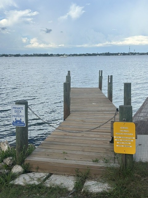The private wooden dock at Gecko House extending into Lemon Bay