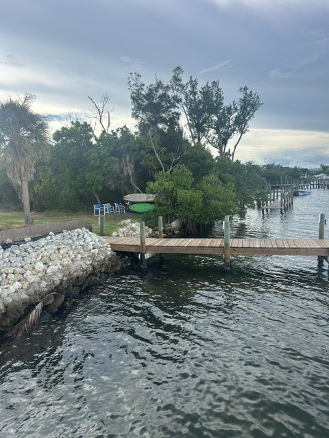 View of the Gecko House dock from the rocky bay shoreline