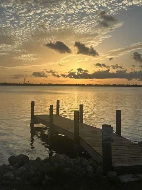The Gecko House dock on Lemon Bay at golden hour