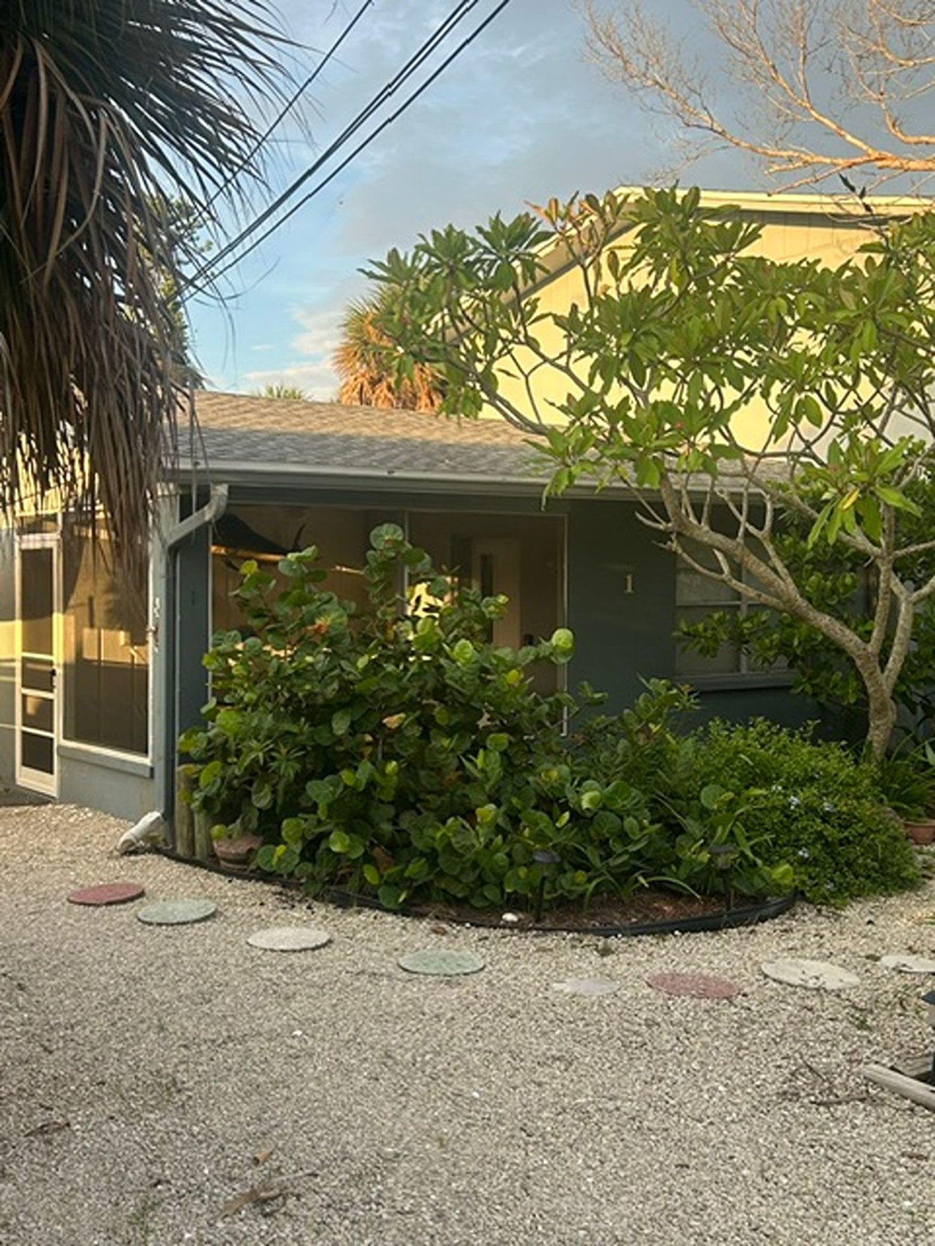 Ground-floor unit at Gecko House surrounded by tropical planting