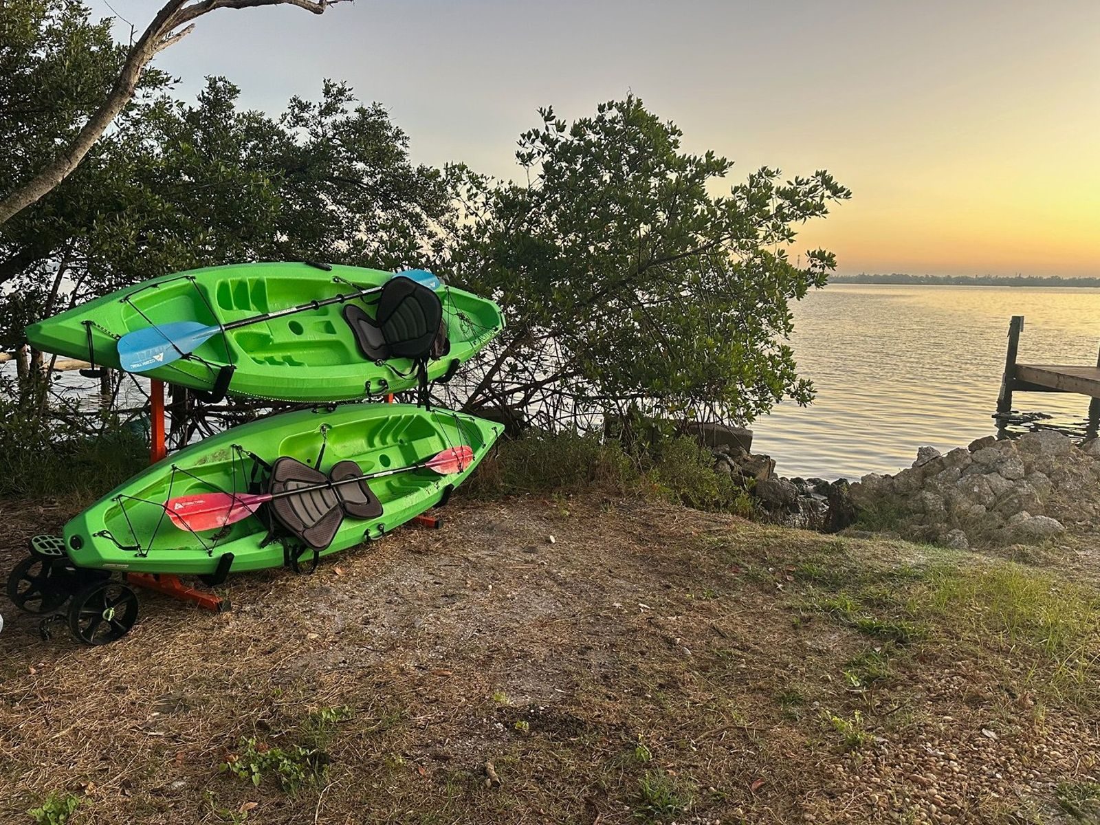 Guest kayaks stored on the rack overlooking Lemon Bay at Gecko House