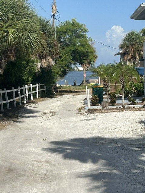 Path opening onto Lemon Bay and the dock at Gecko House